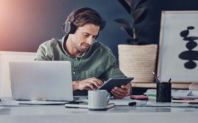 Typing, online and man with tablet, office and laptop for project of video editor and headphones....