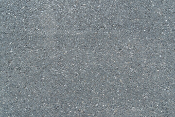 New dry asphalt texture. A frame filled with the textured surface of dry asphalt, showcasing the detailed pattern