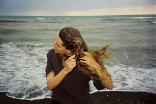 Woman untangling long hair