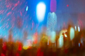 An abstraction with the mood of the blurred lights of a night city