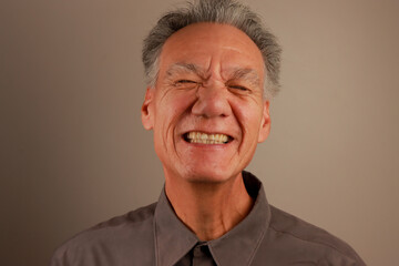 Close up Portrait of a Happy Mature Man smiling