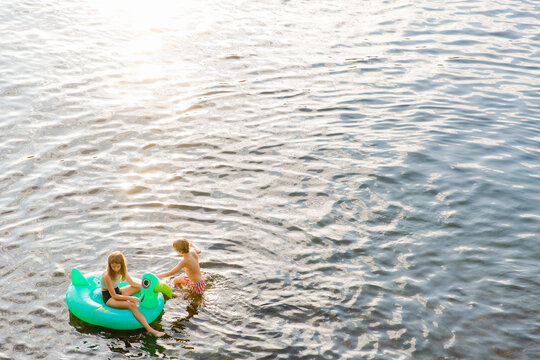Two kids and an inflatable raft