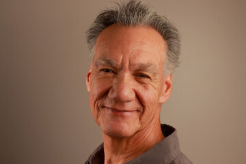 Close up Portrait of a Happy Mature Man smiling

