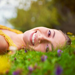 Happy woman, portrait and relax on field in outdoor, travel and countryside nature for peace or...