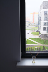 Fototapeta premium view from the window onto a rainy street, modern minimal apartment cozy living