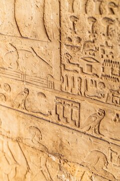 Ancient Egyptian hieroglyphics on stone wall, cultural heritage