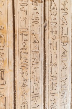 Ancient Egyptian hieroglyphics on stone wall, cultural heritage