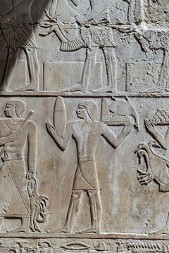 Ancient Egyptian hieroglyphics on stone wall, cultural heritage