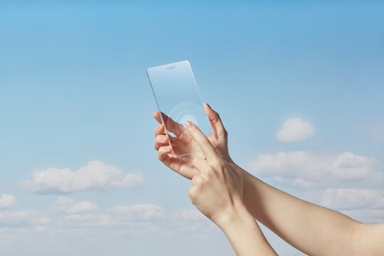 Technology user activating transparent cellphone with touch on screen