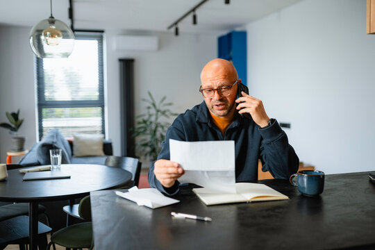 A man is talking on his mobile phone