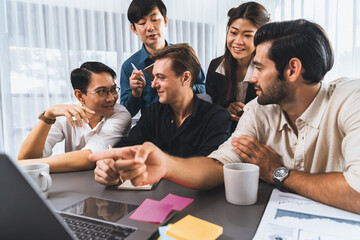 Fototapeta premium Group of diverse office worker employee working together on strategic business marketing planning in corporate office room. Positive teamwork in business workplace concept. Prudent