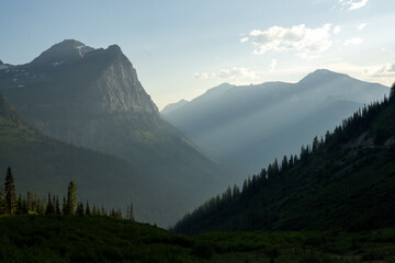 Fototapeta premium Light Breaks Into Silhouetted Layers Below Mount Cannon
