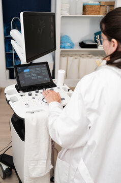 Medical professional operating ultrasound machine