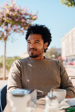 Man waiting at a cafe terrace