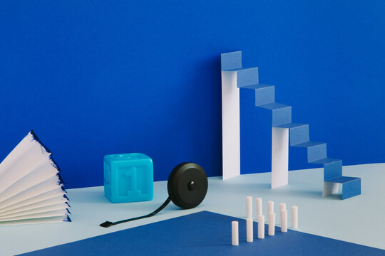 A minimalistic still life with a paper ladder