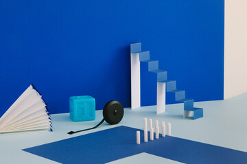 A minimalistic still life with a paper ladder