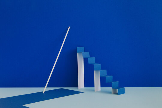 A minimalistic still life with a paper ladder