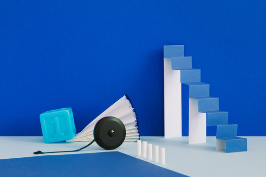A minimalistic still life with a paper ladder
