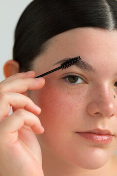 Woman using eyebrow brush