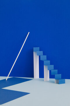 A minimalistic still life with a paper ladder