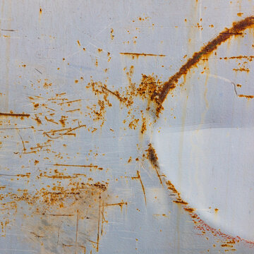 Peeling paint and rusty marks on metal