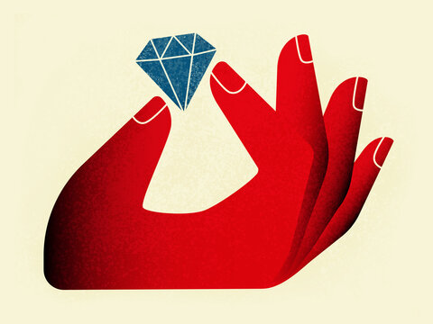 Red hand holding diamond on light background