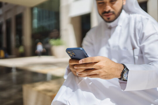 Man Using Mobile in Doha