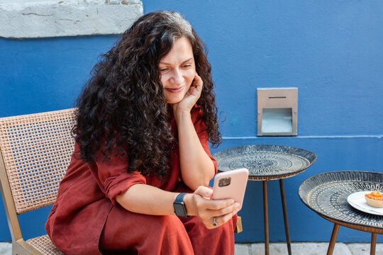 portrait of a cheerful brunette woman