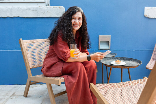 portrait of a cheerful brunette woman