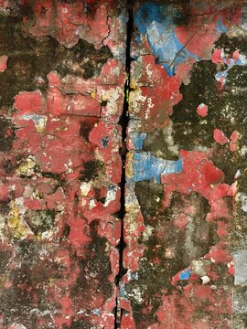 Colourful texture and worn out painting on wall