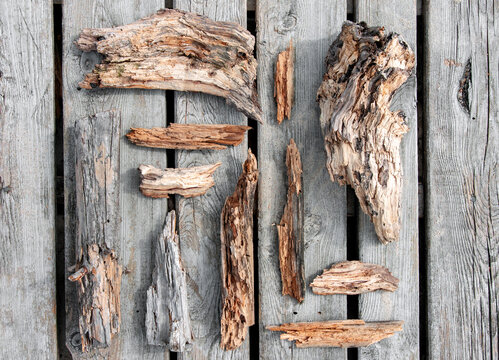 Pieces of old wood neatly arranged on wooden planks