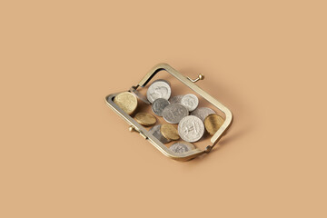 Metal coins poured on top of open lock for change purse