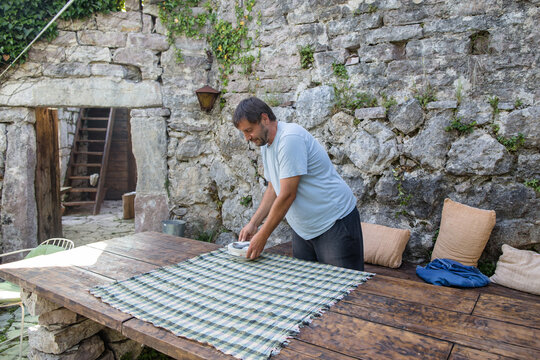 Man serving the table in patio