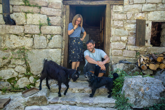 Country spouses and their funny pets by the doorstep 