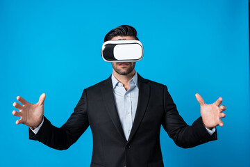 Smart business man with suit holding something while VR goggle to connect metaverse. Professional project manager looking at hologram by using visual reality headset. Technology innovation. Deviation.