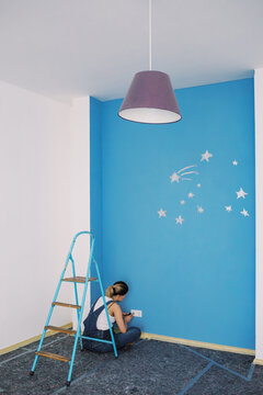Nursery Room with Painted Blue Wall and Stars