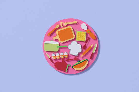 Top View Of Colorful Kitchen Utensils On Pink Background