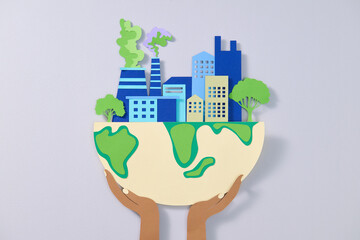 Hands Holding Globe City with Pollution and Trees