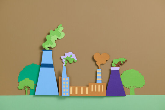 Colorful Paper Cutout of Industrial Factory Buildings with Smoke