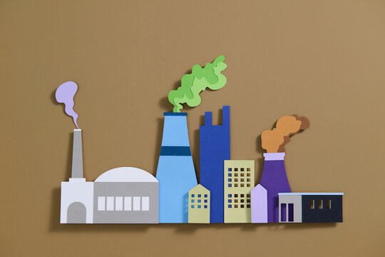 Colorful Paper Cutout of Industrial Factory Buildings with Smoke