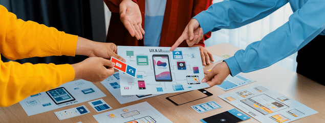 Panorama banner of startup company employee planning on user interface prototype for mobile...