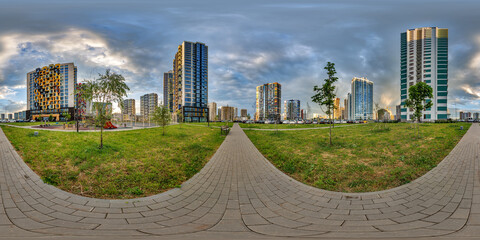hdri 360 panorama near new skyscrapers and residential complex at evening in full equirectangular...