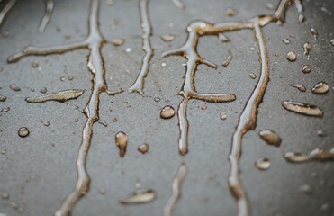exposure of chaotically located and flowing drops on a grey background
