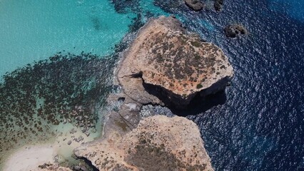 Aerial View of Cominotto, Uninhabited island with white sand beach near Comino, Maltese islands. High quality photo