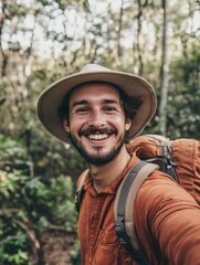 Fototapeta premium A person taking a selfie outdoors, wearing a hat and carrying a backpack