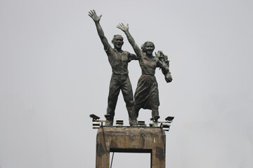 Central Jakarta, Indonesia - July 14, 2024: Welcome Monument at the Hotel Indonesia Roundabout. The statue depicts a pair of figures waving, symbolizing a warm welcome to visitors from around