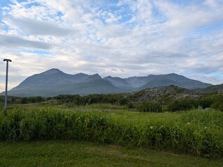 Serene Meadow with Mountain Peaks