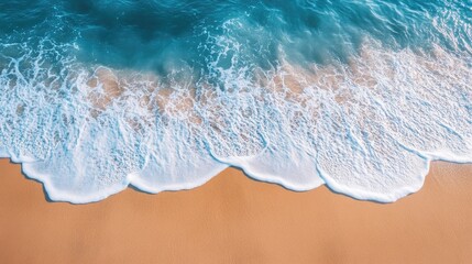 Beautiful panoramic shot of a sandy beach with gentle sea waves lapping at the shore, showcasing a serene landscape.
