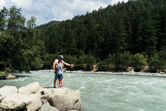 Family by Mountain River