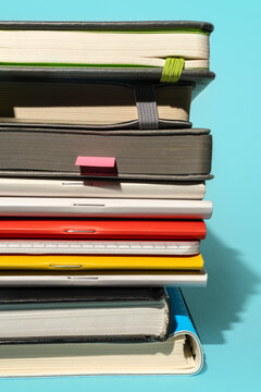 Set of various notebooks and journals with colorful vivid bookmarks. 